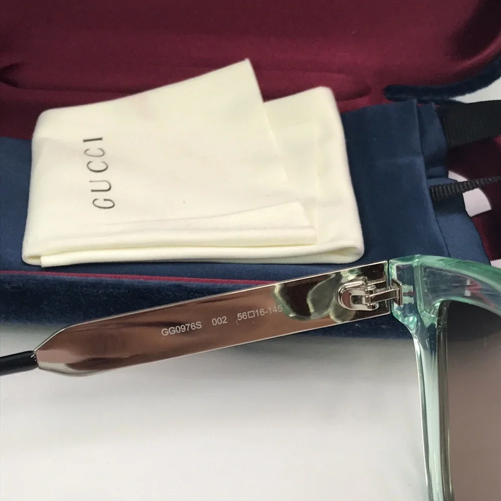 Gucci GG0976S 002 in injected material , in green rectangular/square Sunglasses